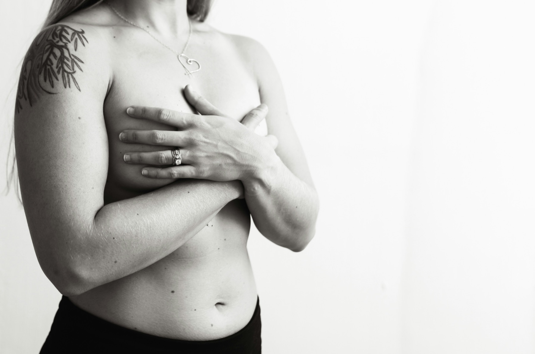 A woman standing with her arms crossed over her chest